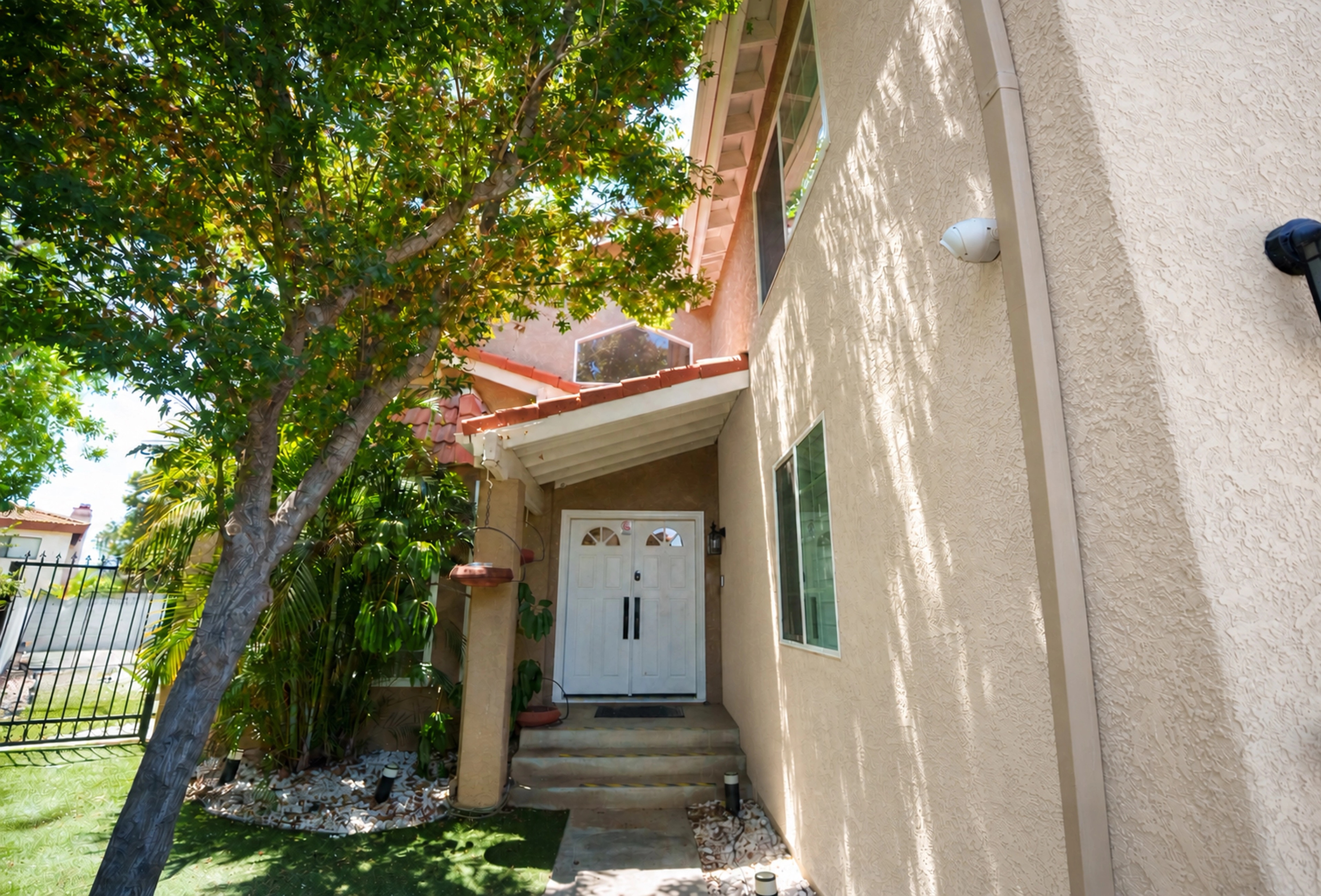 A tree-shaded front entrance.